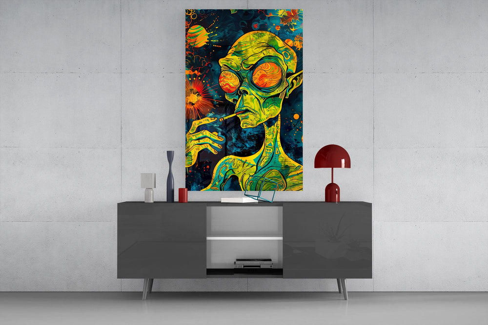 green alien smoking in deep space glass wall art displayed above a console in a designer interior