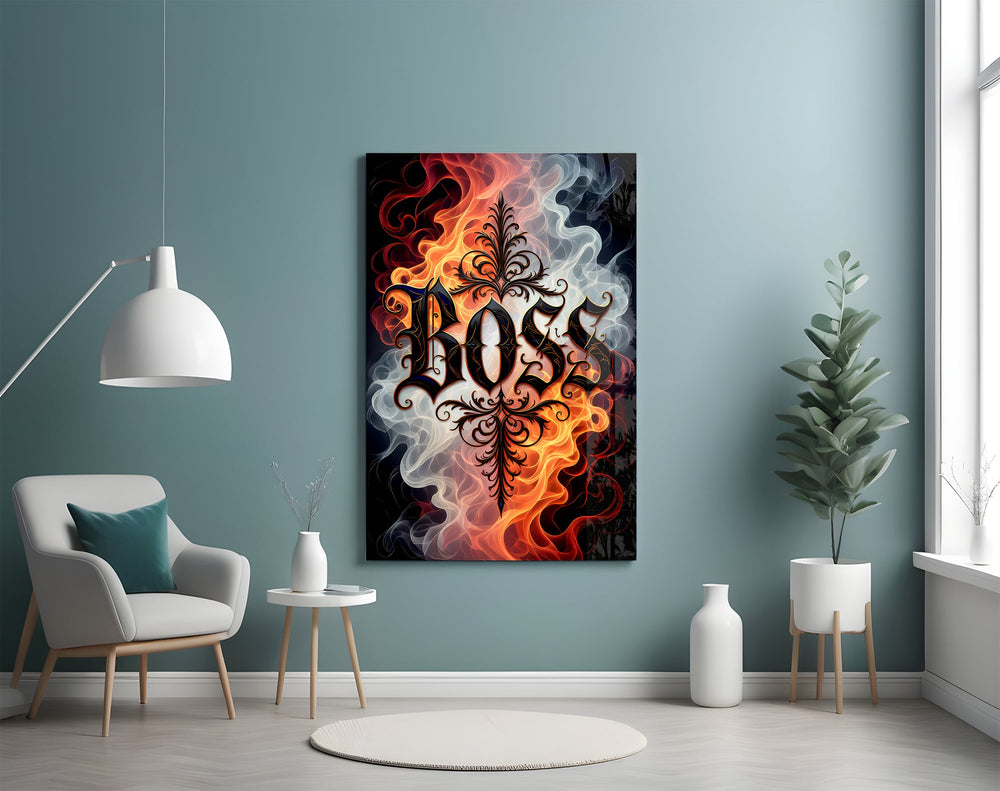 blackletter word in fire and smoke glass wall art styled above an armchair in a reading corner
