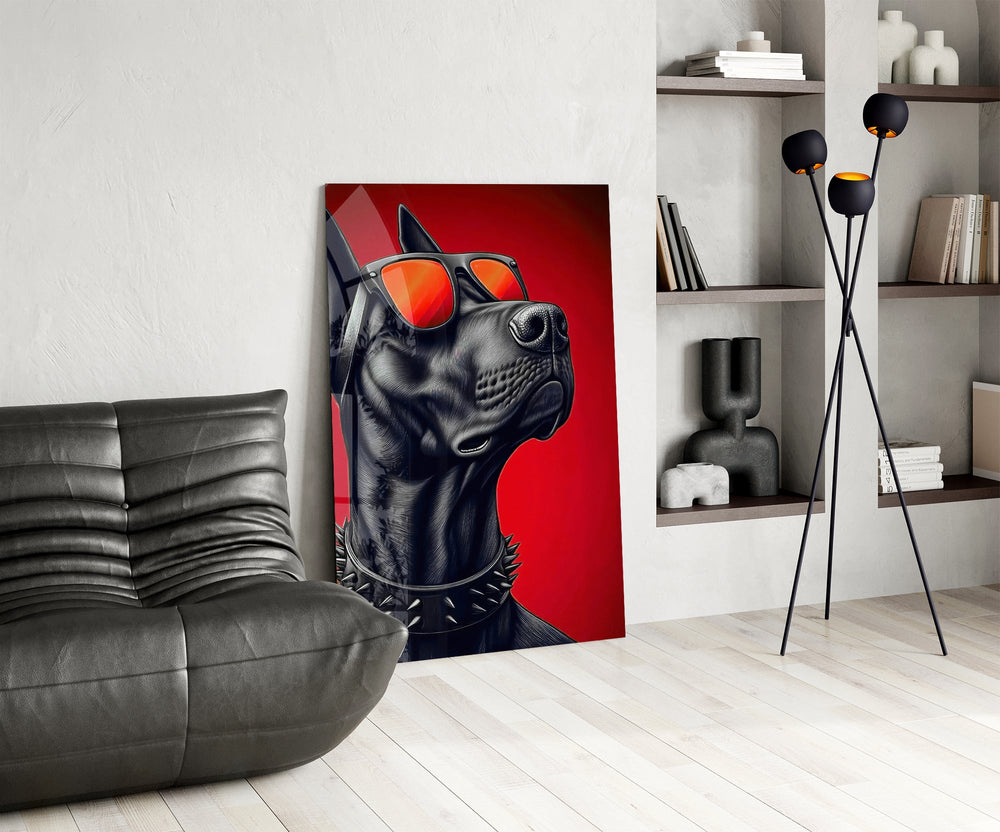 black guard dog on crimson red glass wall art leaning beside a dark leather sofa