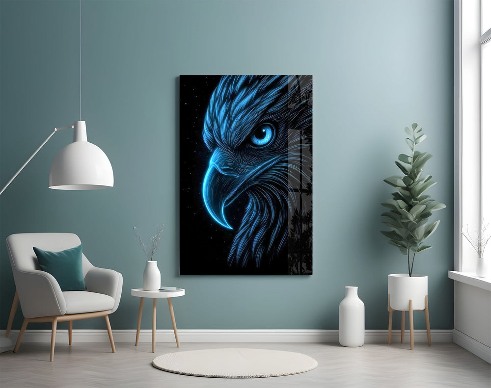 glowing blue eagle head on black glass wall art styled above an armchair in a reading corner
