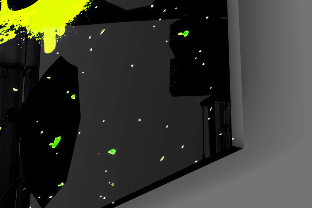 Close-up detail of the sprayed edges and the single drip below the yellow bar on the glass surface