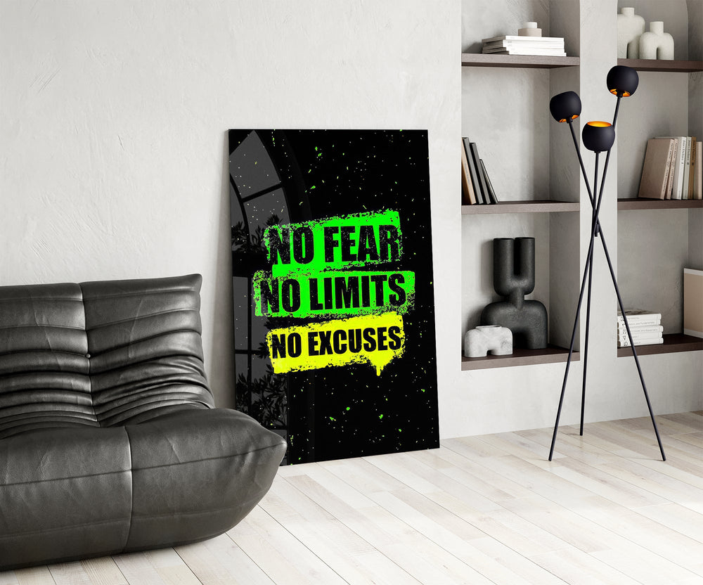 neon green gym motivation typography glass wall art leaning beside a dark leather sofa