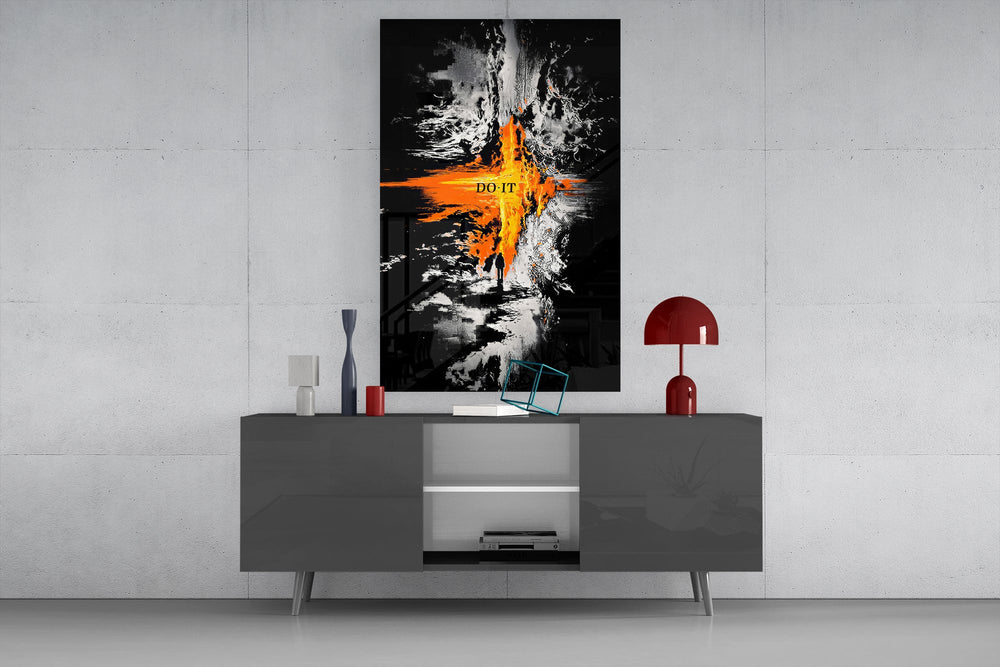 orange lava rift and lone figure glass wall art displayed above a console in a designer interior