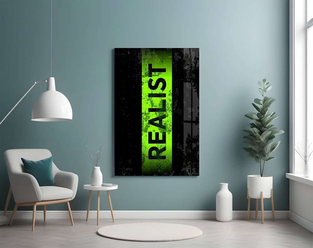 acid green stencil band on distressed black glass wall art styled above an armchair in a reading corner