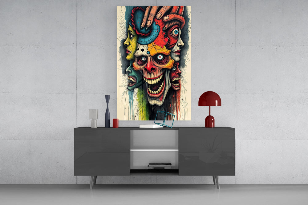 layered faces around a screaming skull glass wall art displayed above a console in a designer interior