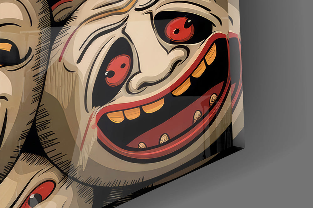 Close-up detail of the hollow-eyed smiling mask at the left of the stack on the glass surface