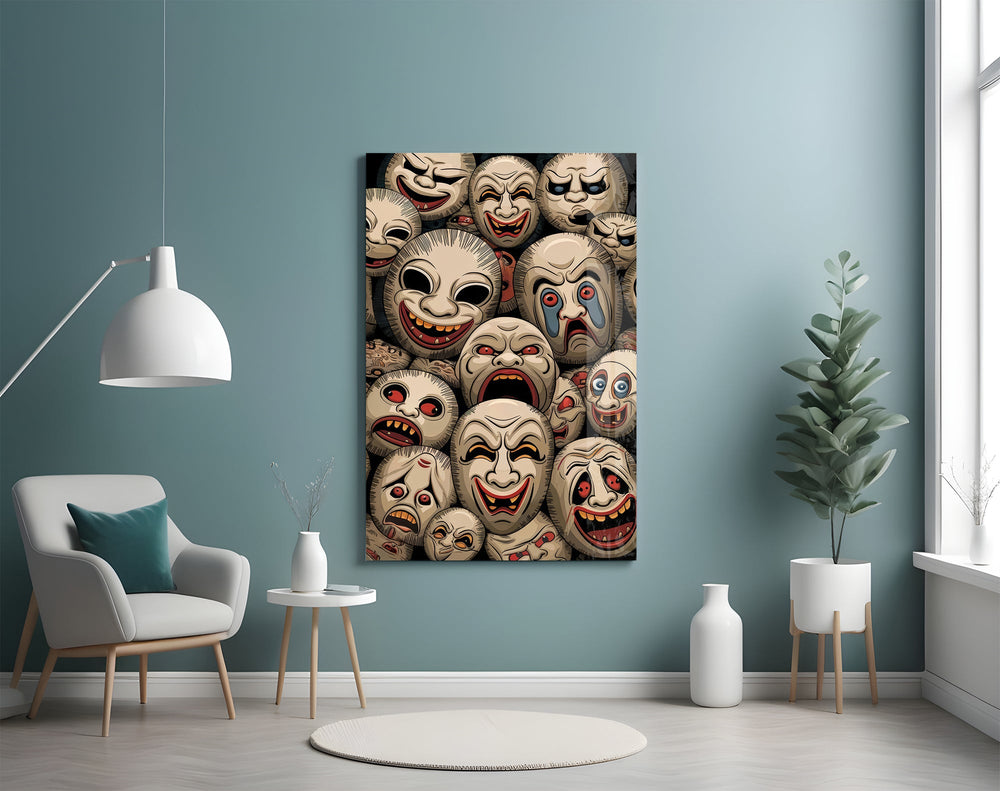 stacked sepia theatre masks glass wall art styled above an armchair in a reading corner