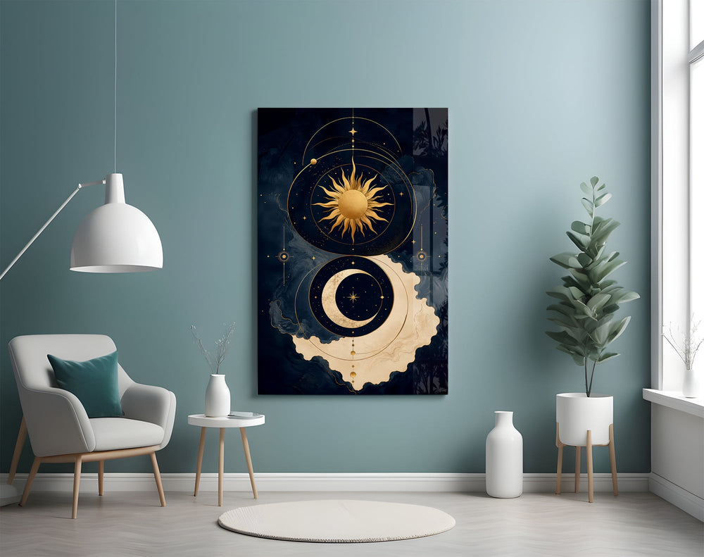 a gold sun and crescent moon on navy glass wall art styled above an armchair in a reading corner