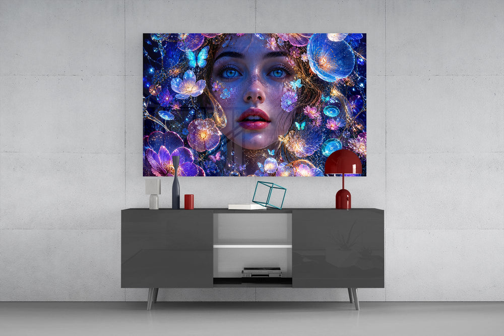 a blue-eyed woman among glowing flowers glass wall art displayed above a console in a designer interior