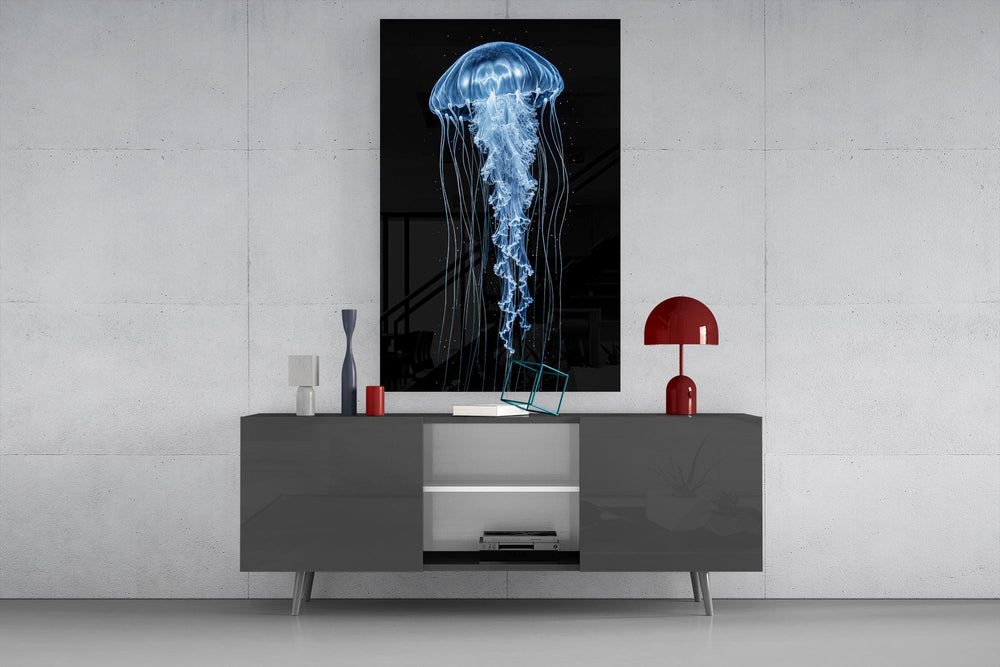 a blue jellyfish in black water glass wall art displayed above a console in a designer interior