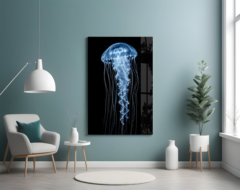 a blue jellyfish in black water glass wall art styled above an armchair in a reading corner