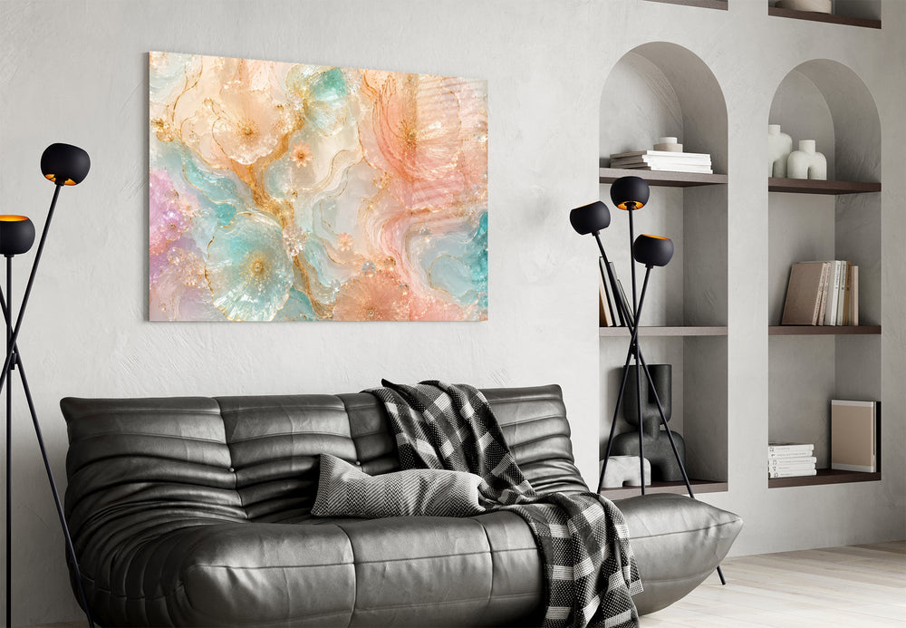 translucent peach and mint petals in gold glass wall art styled above an armchair in a reading corner