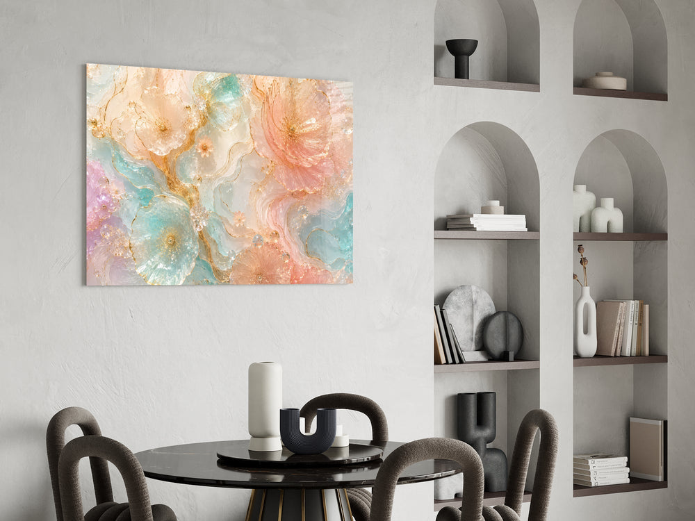 translucent peach and mint petals in gold glass wall art leaning beside a dark leather sofa