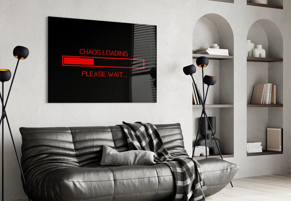 chaos loading red progress bar glass wall art styled above an armchair in a reading corner