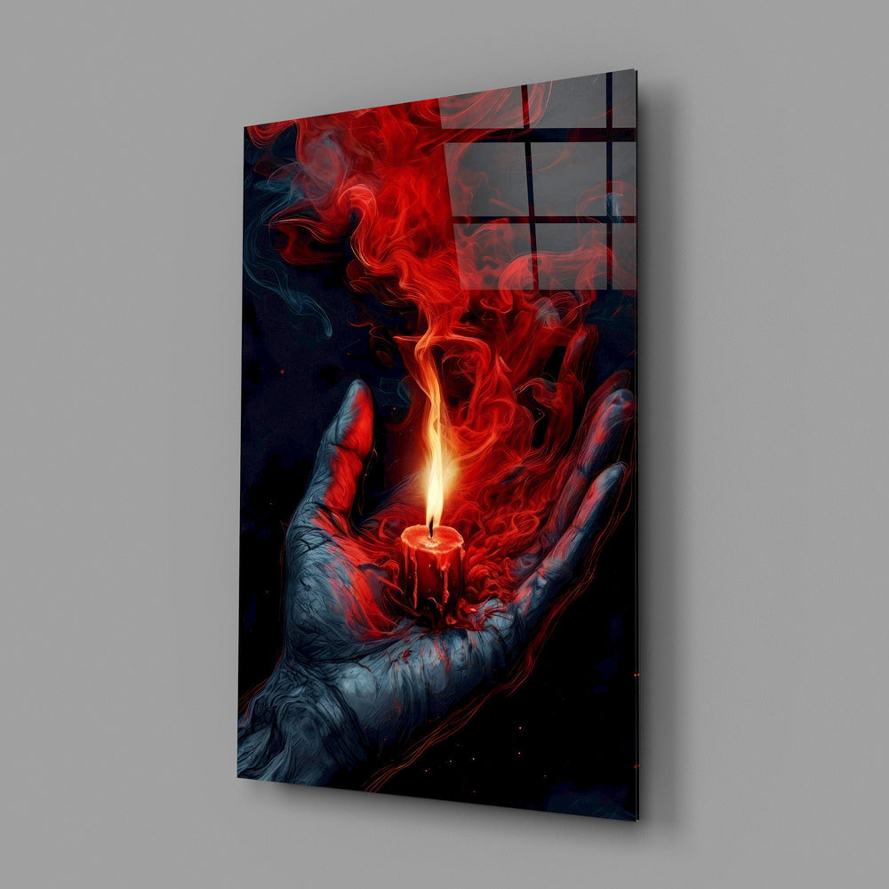 a cupped hand holding a burning red candle glass wall art angled to show the polished tempered glass panel