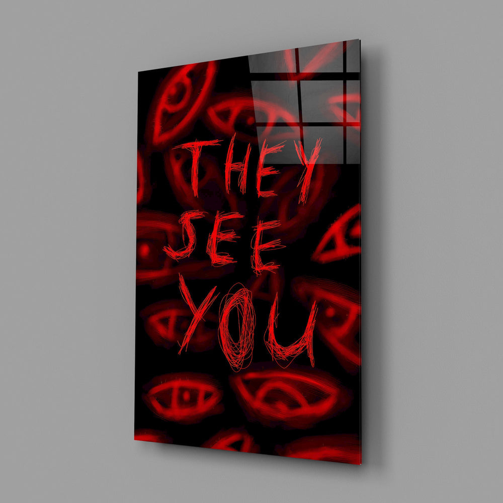 a red handwritten warning over watching eyes glass wall art angled to show the polished tempered glass panel