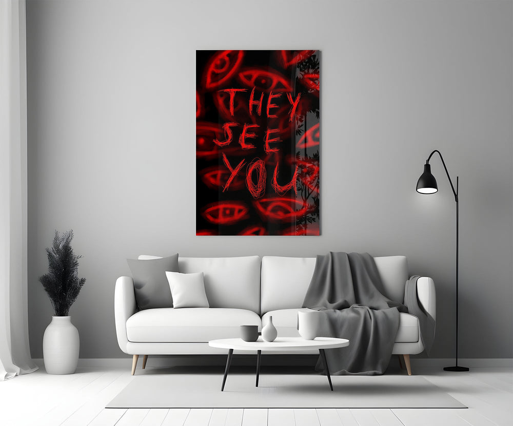 a red handwritten warning over watching eyes panel bringing character to a minimalist living room wall