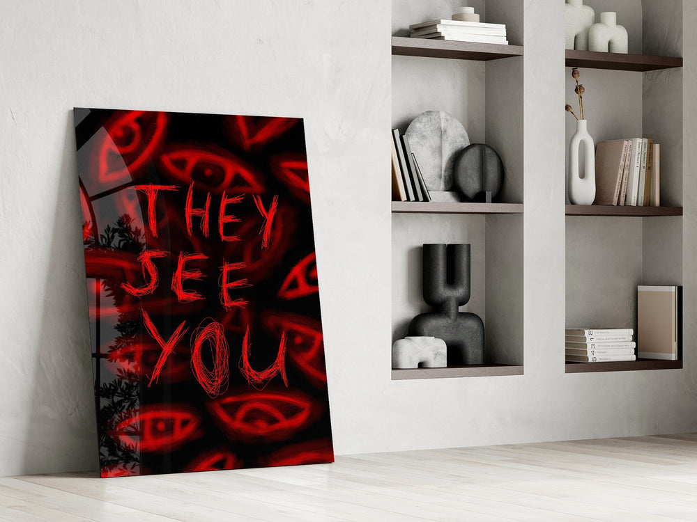 a red handwritten warning over watching eyes panel resting in a shelving niche in a modern interior