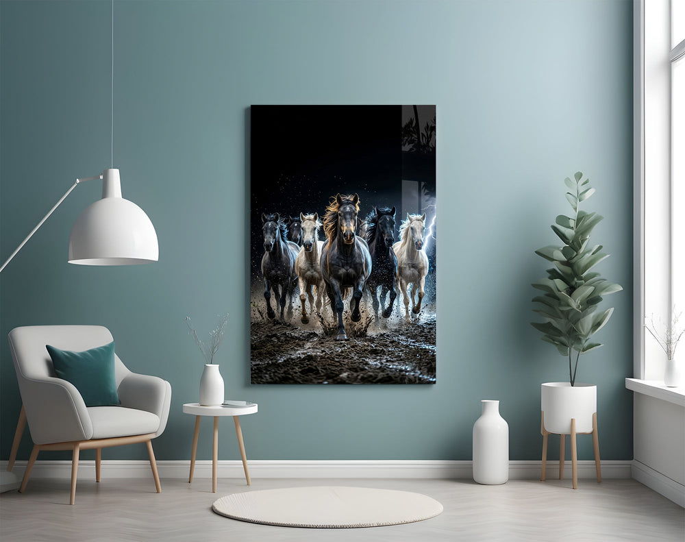 a herd of horses galloping through a storm glass wall art styled above an armchair in a reading corner