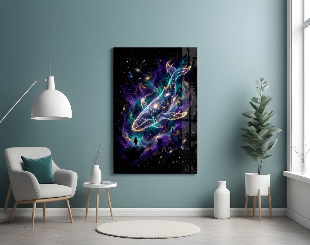 a galaxy-filled whale swimming through a nebula glass wall art styled above an armchair in a reading corner