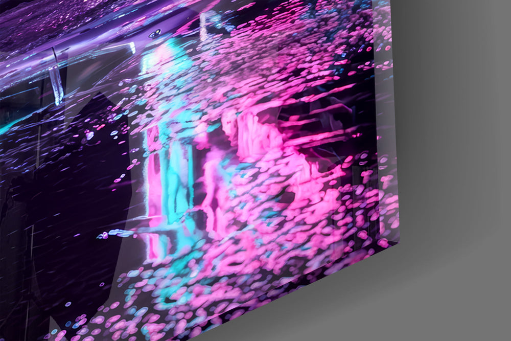 Close-up detail of the wet asphalt breaking the pink and cyan neon into ripples on the glass surface