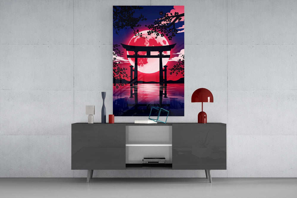 a torii gate before a crimson moon glass wall art displayed above a console in a designer interior