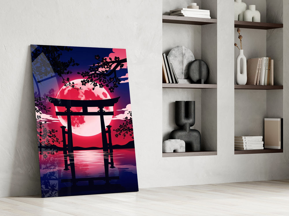 a torii gate before a crimson moon panel resting in a shelving niche in a modern interior