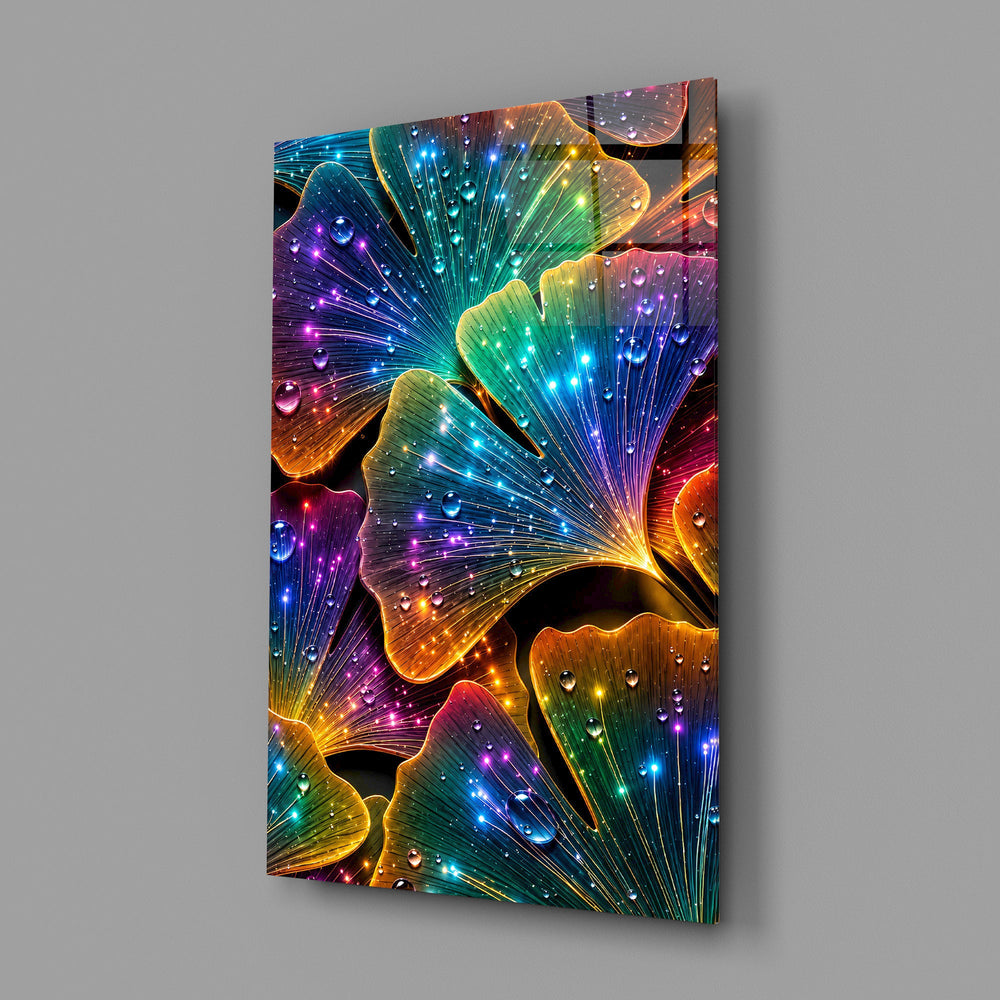 rainbow neon ginkgo leaves with dewdrops glass wall art angled to show the polished tempered glass panel