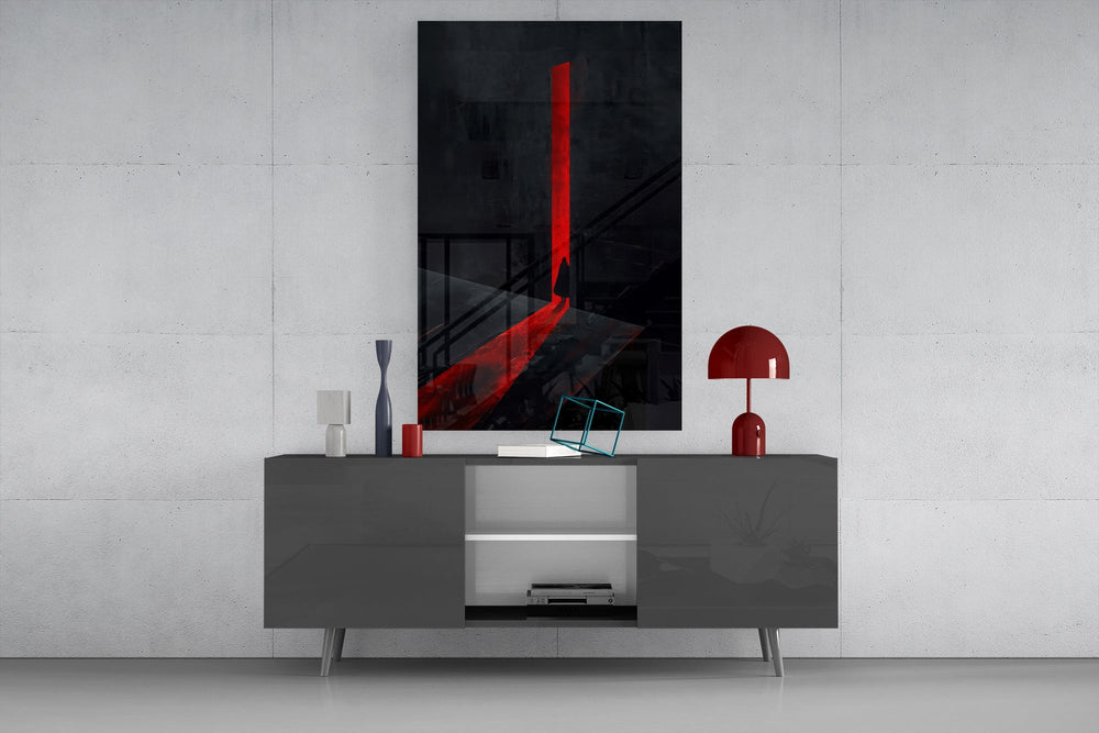 a cloaked figure at a red doorway glass wall art displayed above a console in a designer interior