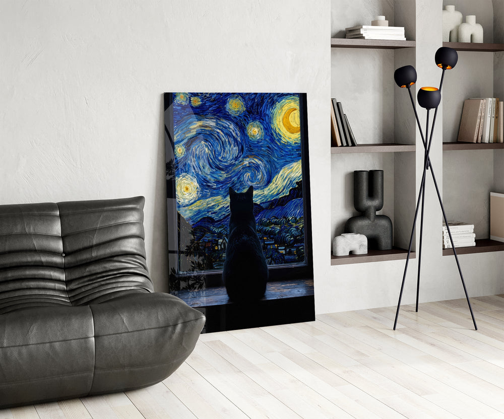 black cat at a starry night window glass wall art leaning beside a dark leather sofa