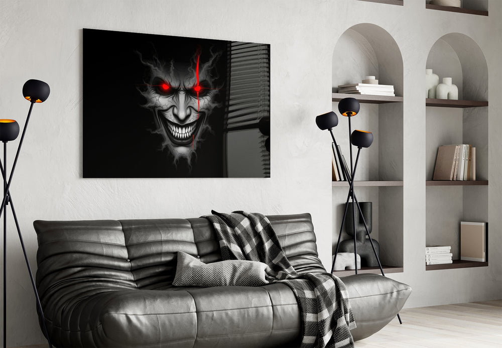 cracked gray grinning demon face glass wall art styled above an armchair in a reading corner