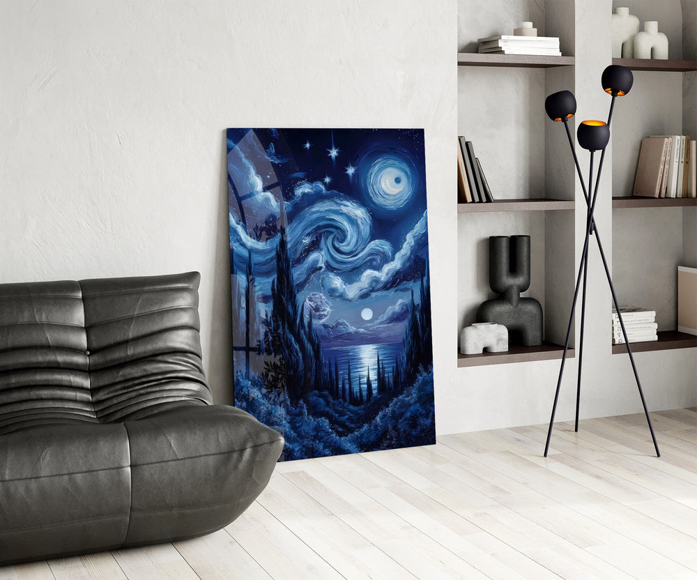 swirling starry night sky over water glass wall art leaning beside a dark leather sofa