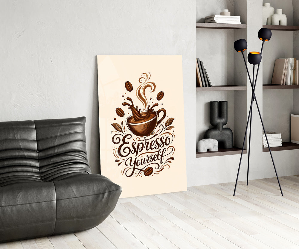 a splashing espresso cup with lettering glass wall art leaning beside a dark leather sofa