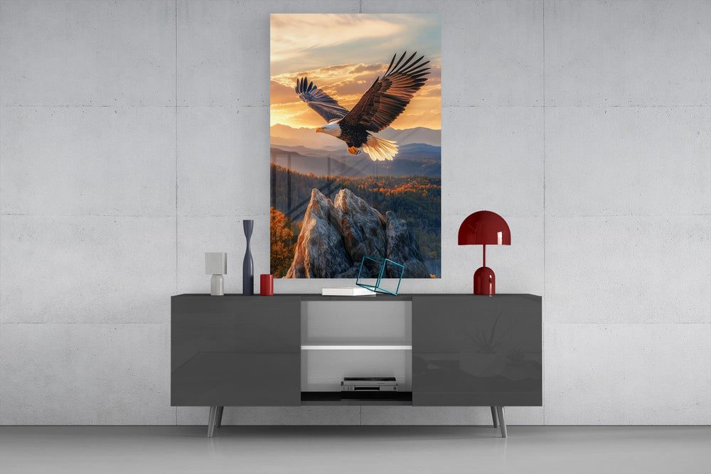 a bald eagle over autumn mountains at sunset glass wall art styled in an atmospheric room setting