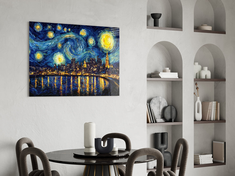 a swirling starry night over a city skyline glass wall art leaning beside a dark leather sofa