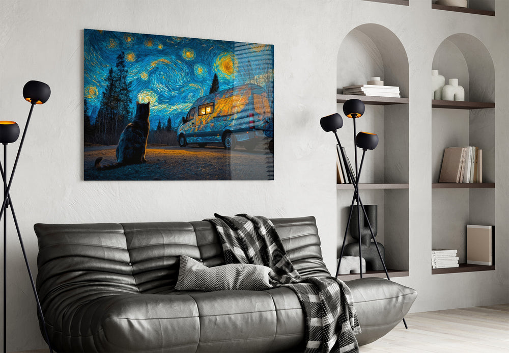 a cat watching a camper van under a swirling starry sky glass wall art styled above an armchair in a reading corner