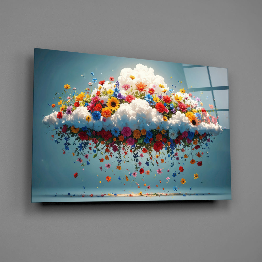 a white cloud bursting with colorful wildflowers glass wall art angled to show the polished tempered glass panel
