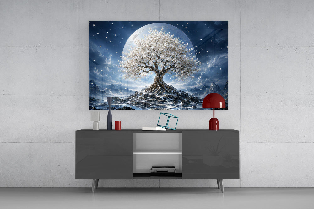 a white blossom tree beneath a full moon glass wall art styled in an atmospheric room setting