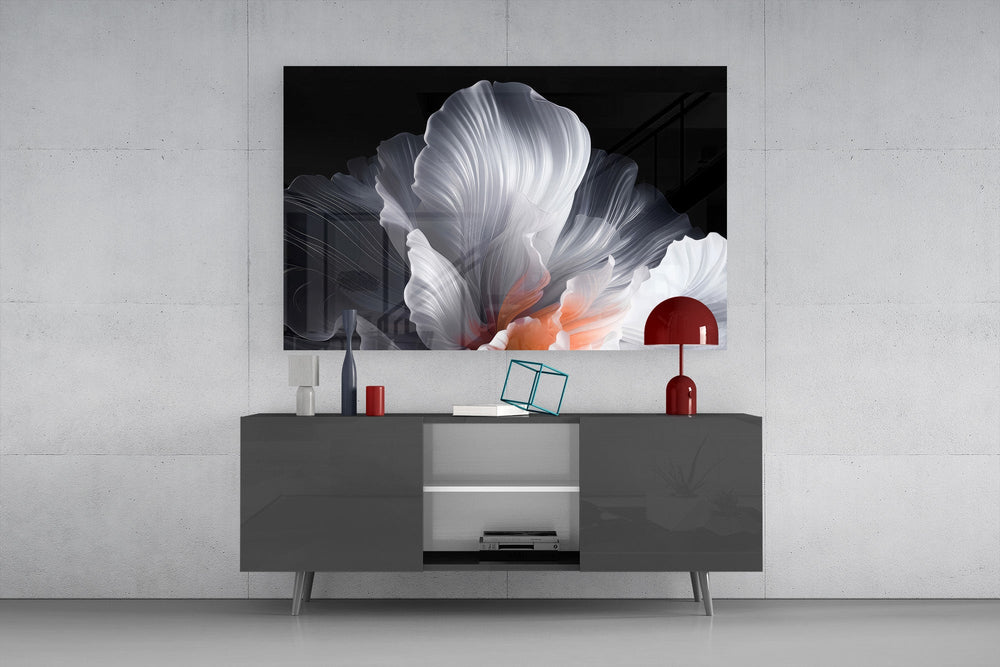an abstract white flower on black glass wall art styled in an atmospheric room setting
