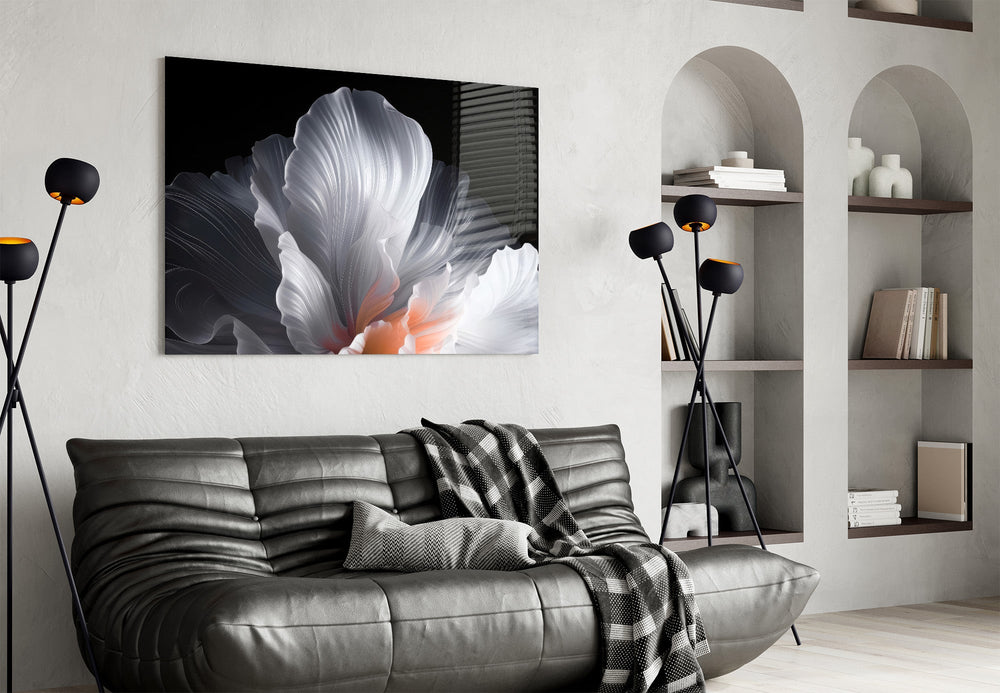an abstract white flower on black glass wall art styled above an armchair in a reading corner