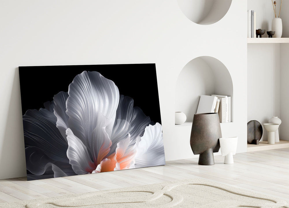 an abstract white flower on black panel bringing character to a minimalist living room wall