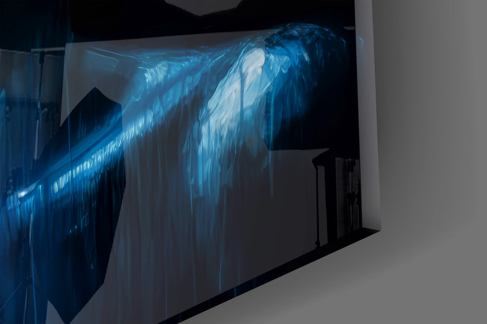 Close-up detail of the ring of sunflowers above the dripping blue skin on the glass surface