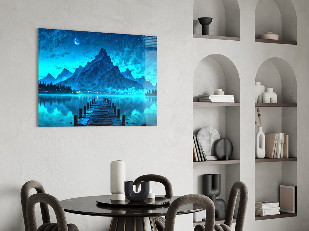moonlit mountain lake with a dock glass wall art leaning beside a dark leather sofa