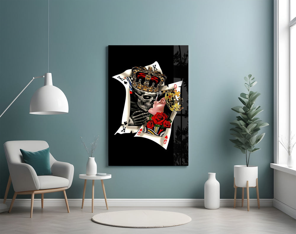 skull king and masked queen cards glass wall art styled above an armchair in a reading corner