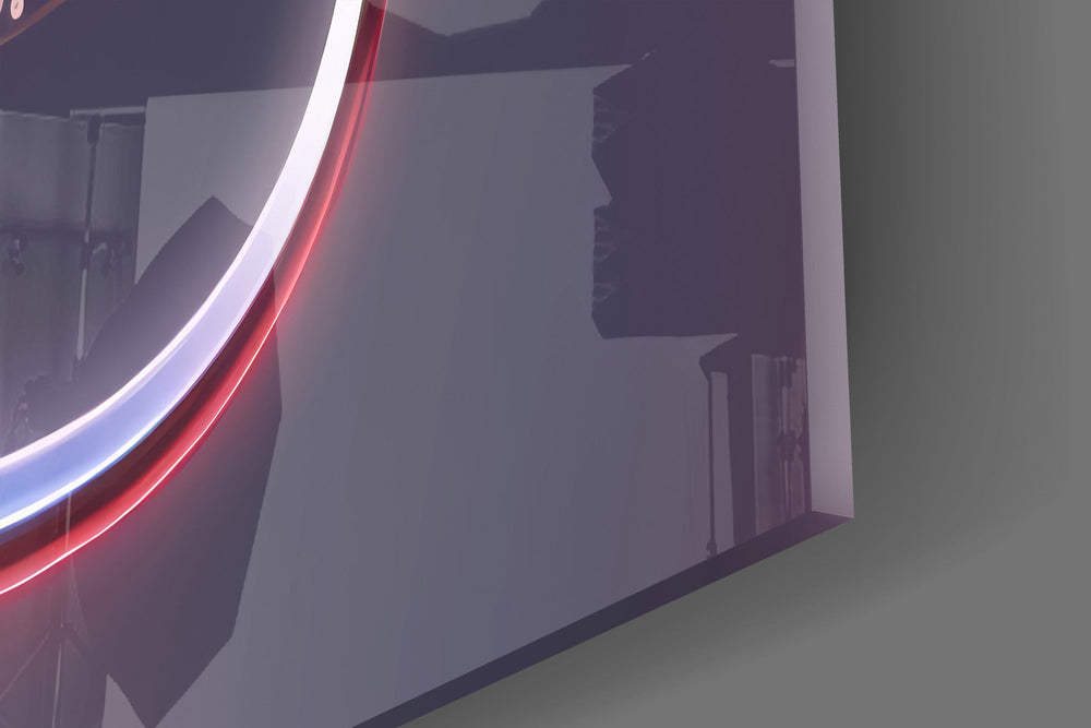 Close-up detail of the liquid-chrome ribbon looping around the pink lettering on the glass surface