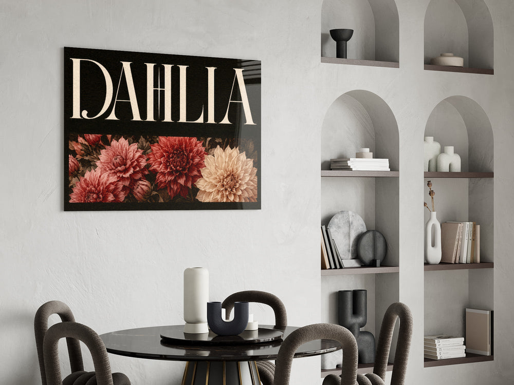 dahlia bloom typography glass wall art leaning beside a dark leather sofa