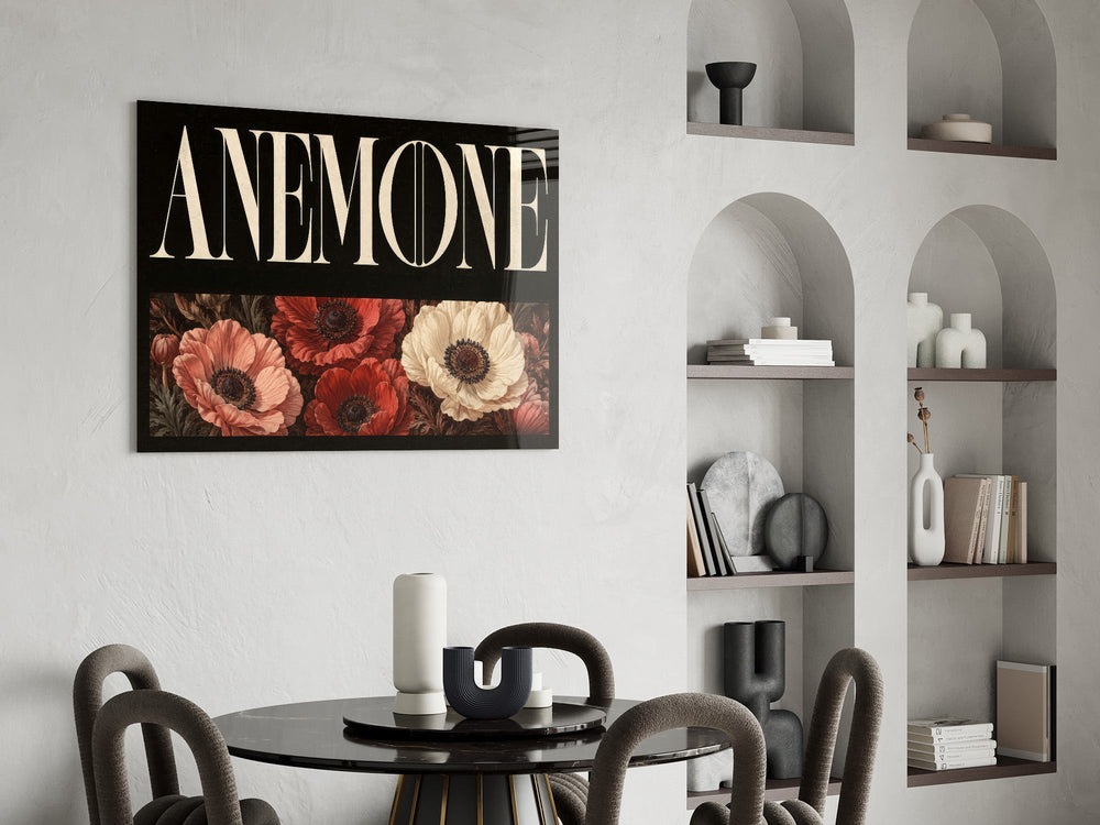anemone bloom typography glass wall art leaning beside a dark leather sofa