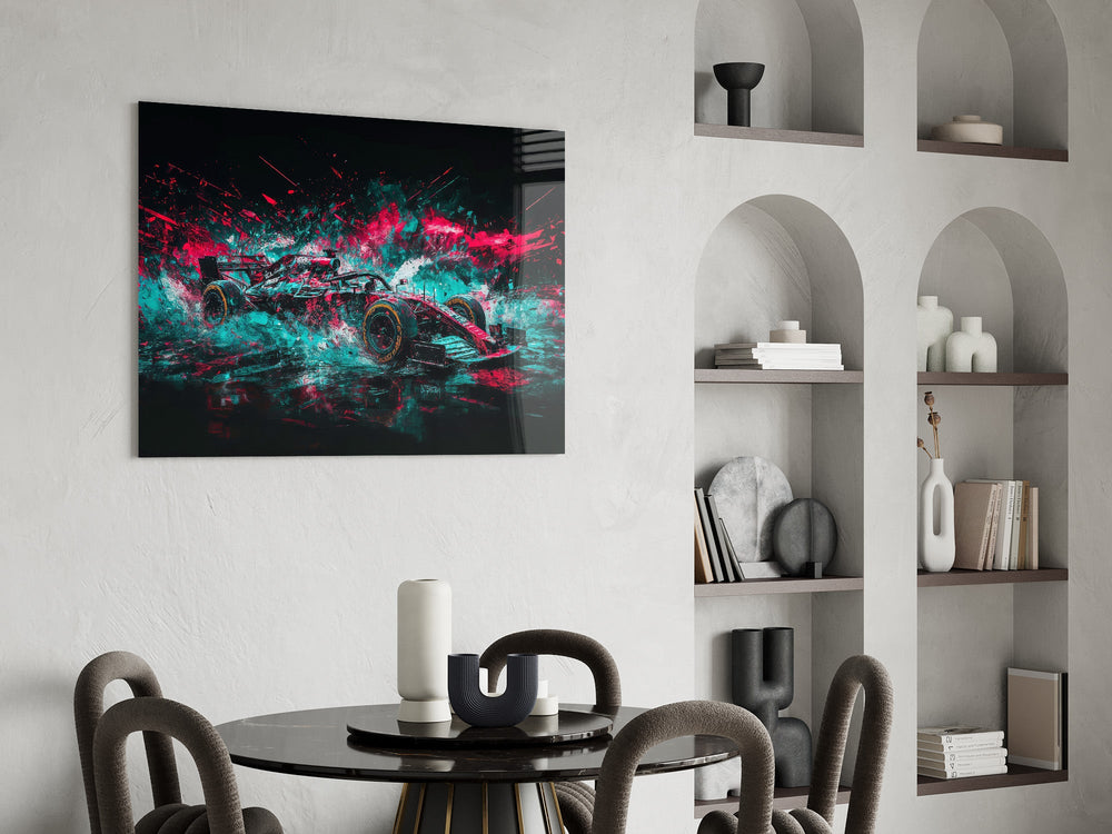 teal and pink open-wheel race car glass wall art leaning beside a dark leather sofa