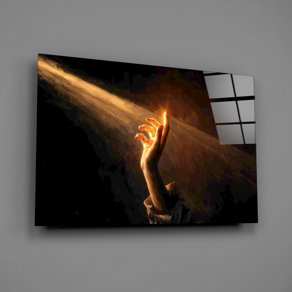 a hand reaching into a golden light beam glass wall art angled to show the polished tempered glass panel