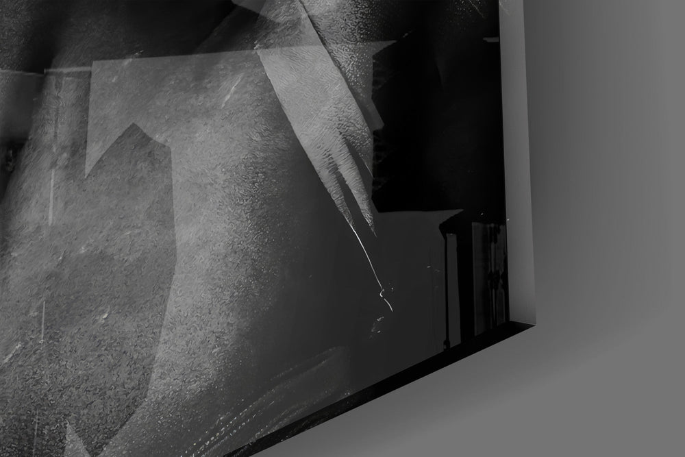 Close-up detail of the black censor bar and marcel-waved curls on the glass surface